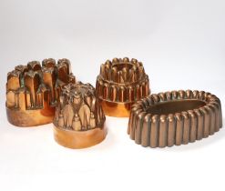 Four Victorian copper jelly moulds, one stamped with Benham & Froud mark and ‘Temple & Crook