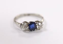 An early to mid 20th century white metal (stamped plat), single stone sapphire and two stone diamond