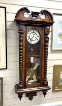 A late 19th century walnut Vienna regulator, with pendulum, weight and key, height 116cm.