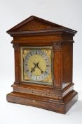 Victorian oak mantel clock, brass dial and mask spandrels; Winterhalder & Hoftmier two train