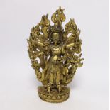 A Sino-Tibetan gilt bronze figure of Mahakala with flame form mandala, 29cm high