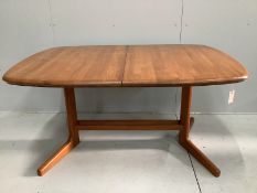 A mid century teak extending dining table, length 150cm, width 106cm, height 74cm and six chairs,
