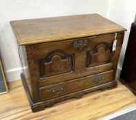 A mid 18th century Welsh oak coffer back with twin panelled front, width 65cm, depth 36cm, height