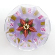 A Paul Ysart faceted ‘flower’ glass paperweight, Harland period, the central flower within