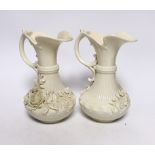 A pair of Belleek jugs with applied rose decoration, 19 cm high