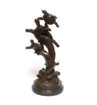 A bronze turtle figure group on cresting waves, 41cm high