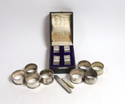 A cased set of four George V silver napkin rings, Rolason Brothers, Birmingham, 1920, together