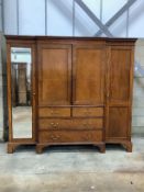 A 19th century and later mahogany breakfront wardrobe with linen press centre section, width