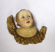 A carved wood gilt and painted cherub wall appliqué, 23cm