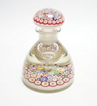 A Paul Ysart close packed millefiori glass inkwell or bottle and stopper, Caithness period,