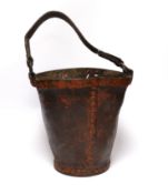 A painted leather fire bucket with the remains of what might have been an armorial crest, 26.5cm