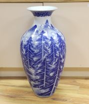 A large Japanese Arita blue and white vase, late 19th century, decorated with pine trees and