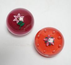 Two Paul Ysart glass ‘flower specimen’ paperweights, both Harland period, the first with a pink