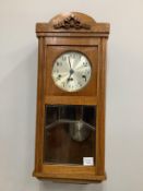 An early 20th century oak wall clock, height 70cm