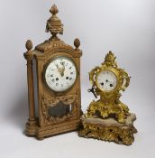 A late 19th century French carved blonde wood mantel clock and similar gilt metal mantel clock.