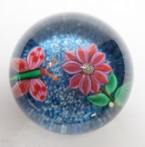 A rare Paul Ysart ‘insect and flower’ footed glass paperweight, Caithness period, scratched