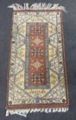 A Turkish geometric rug, 154 x 84cm