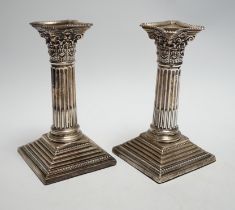 A pair of George V silver mounted Corinthian column dwarf candlesticks, London, 1911, 15.7cm,