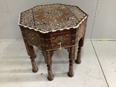 A 19th century Indian Hoshiarpur brass mounted octagonal bone inlaid table, fitted two drawers on