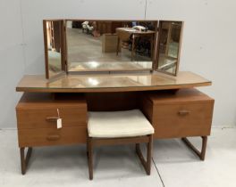 A mid century G Plan teak dressing table, width 152cm, depth 47cm, height 117cm and stool