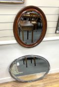An early 20th century oval mirror, width 62cm and an early 20th century oval mirror, nickel plated