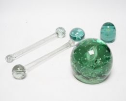 Three 19th century green glass Stourbridge dumps, one large, 12cm diam. and two small, 6cm diam.,