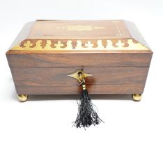 A George IV rosewood and cut brass sewing box with fitted interior, cotton reels, thread and