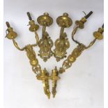 A pair of ormolu two branch wall lights, a pair of single branch mask wall lights and a small pair