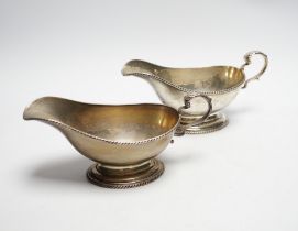 A pair of George V silver oval pedestal sauceboats, London, 1917, 19cm length, 10.6oz.