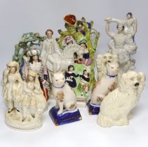 Seven Staffordshire flat backs, including a gentleman on horse back, two seated lovers, a similar