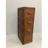 An early 20th century oak four drawer filing cabinet, width 41cm, depth 60cm, height 130cm