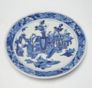 A 19th century Chinese blue and white ‘Hundred Antiques’ dish, with fish to the border, 30cm in