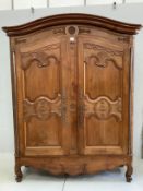 A Louis XV style carved walnut two door armoire, width 150cm, depth 50cm, height 200cm