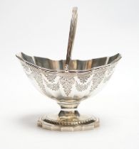 A George III silver boat shaped pedestal sugar basket, John Hutson, London, 1788, length 13.2cm, 5.