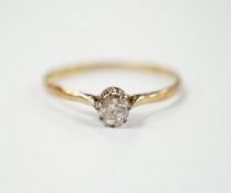 A 1920's 18ct gold and solitaire diamond set ring, size V, gross weight 1.8 grams.