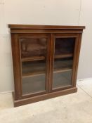 An Edwardian glazed mahogany bookcase, width 103cm, depth 27cm, height 107cm