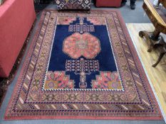 A North West Persian style machined blue ground carpet together with a similar runner, larger 295