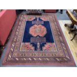 A North West Persian style machined blue ground carpet together with a similar runner, larger 295