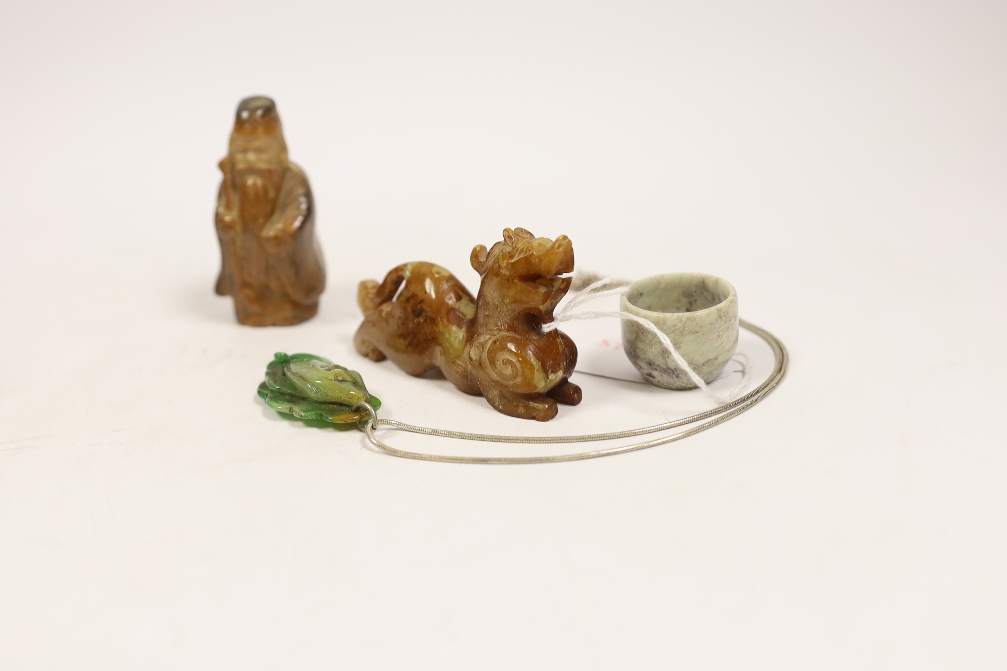 Six Chinese items including a carved jade fish pendant, a jade ring, a bowenite jade figure, an - Image 3 of 4