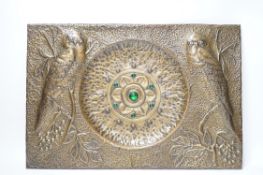A planished bronzed metal panel decorated with owls, 32.5x48cm