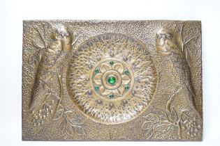 A planished bronzed metal panel decorated with owls, 32.5x48cm