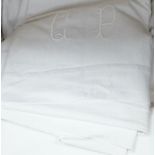 Twelve coarse woven, mostly monogrammed sheets