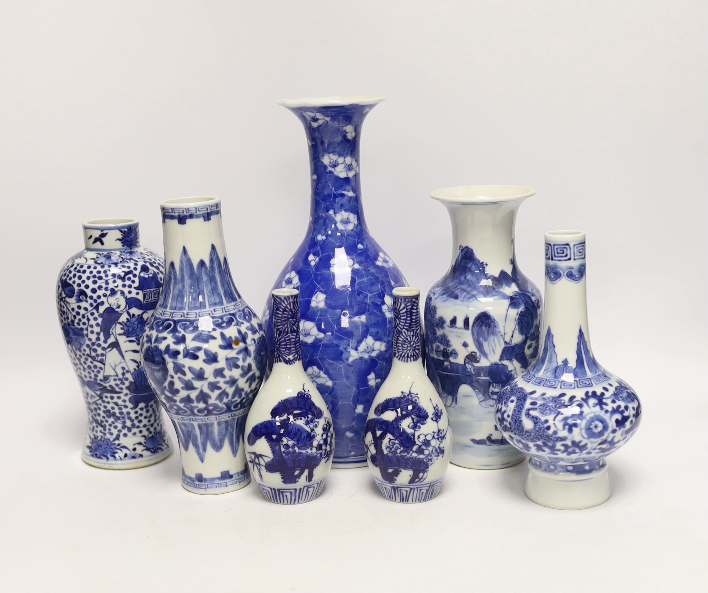 Seven Chinese or Japanese blue and white vases, late 19th/early 20th century, largest 27cm high