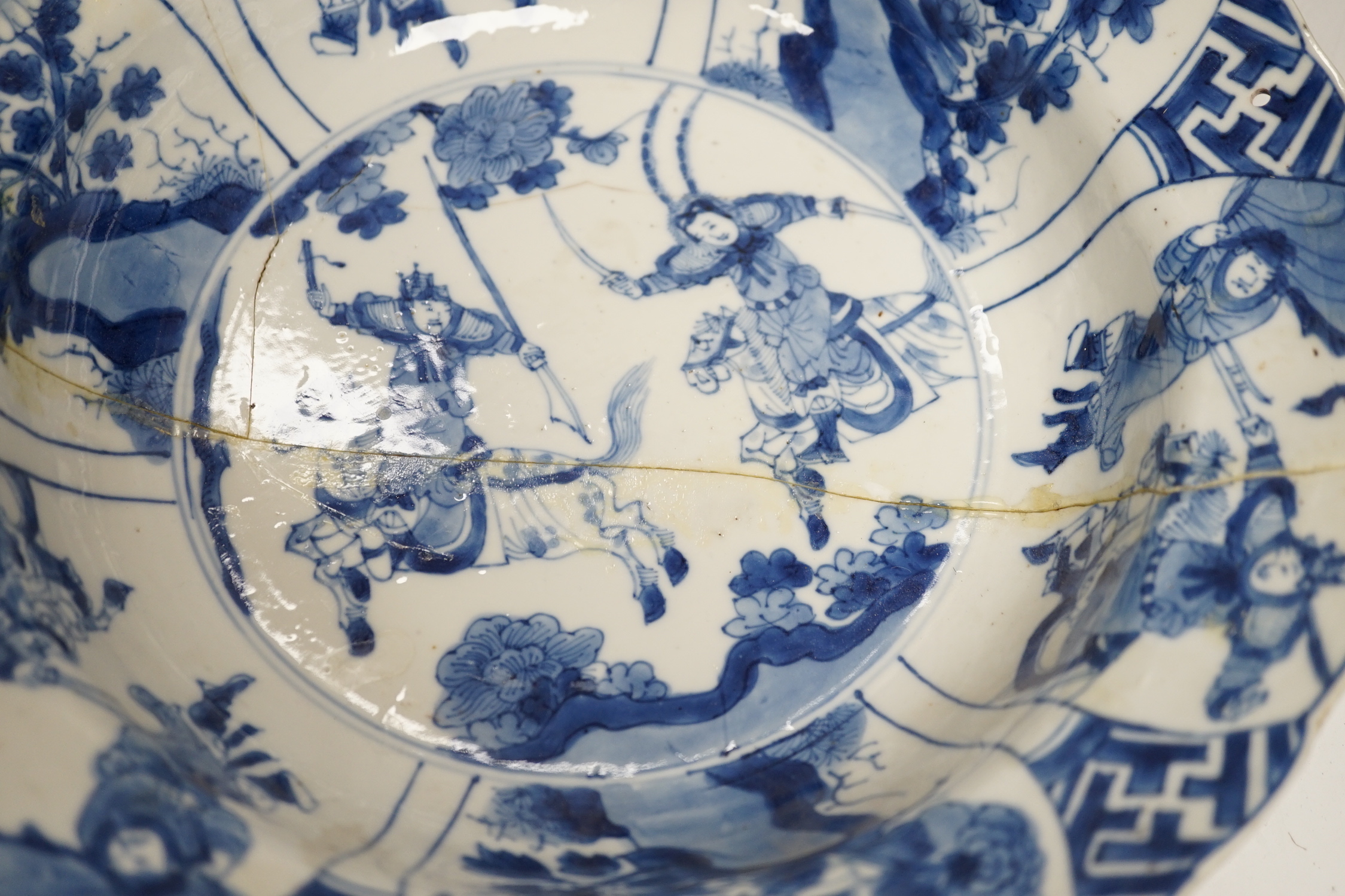 A Chinese blue and white ‘warriors’ bowl, Kangxi mark and period, a similar ‘hunting’ saucer dish, - Image 5 of 8