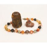 An agate bead necklace, a Chinese soapstone seal and a miniature carved agate Buddha, 4cm