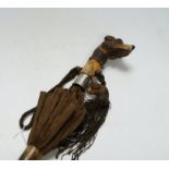 A Victorian silk parasol, carved ‘dogs head’ handle with articulated jaw and telescopic bamboo