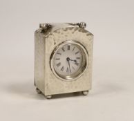 An Edwardian planished silver cased carriage timepiece, W & G Neal, London, 1906, on ball feet,