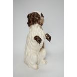 A 'Martel' pottery model of a dog, 33cm