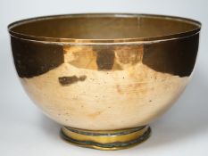 A large copper bowl with brass foot rim, 39cm diameter