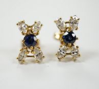 A modern pair of 18ct gold, sapphire and diamond cluster set 'X' ear studs, 12mm, gross weight 2.2